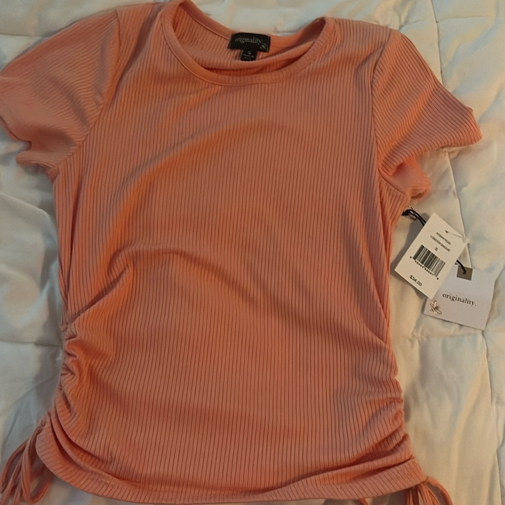 brand; originality. size small , never worn